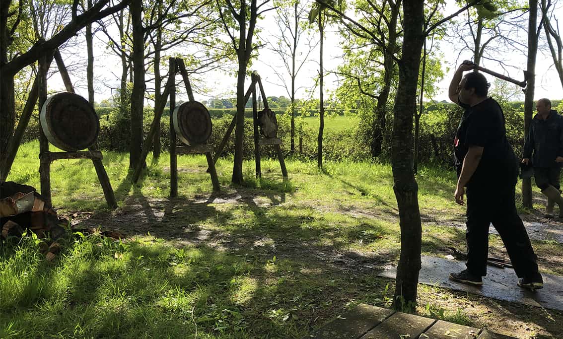  people throwing axes during an activity day